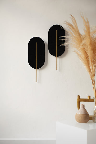 Wall lamp ROKKE black with a brass decorative element UMMO